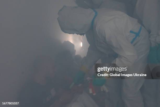 Participants of training take part in chemical, biological, radiological, nuclear and explosive exercises on September 5, 2023 in Dnipro, Ukraine....