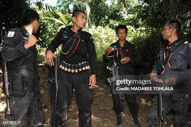 Thai rangers guard the area where a suspected separatist militant a was shot dead during a clash with army rangers in the Cha-nea district of...