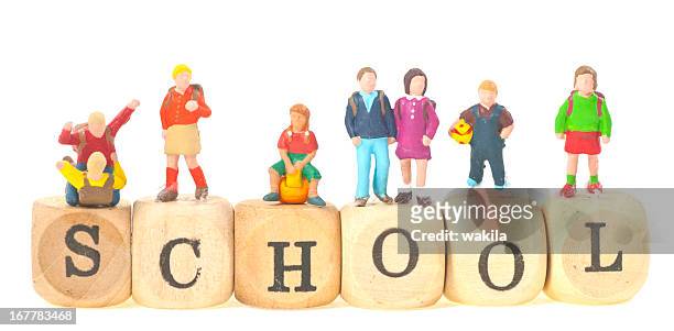 school with pupils and teacher - sweet little models stock pictures, royalty-free photos & images