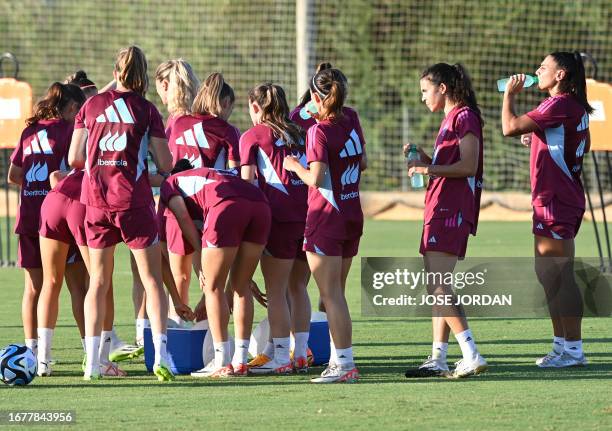Spain's players dring during a training session in Oliva near Valencia, on September 20, 2023 ahead of their UEFA Nations League football matches...