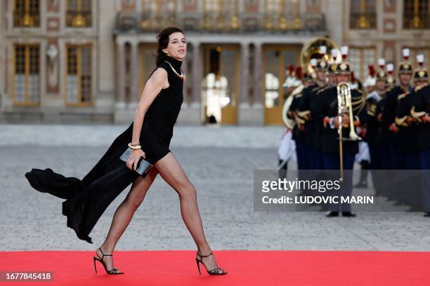 French actress and singer Charlotte Gainsbourg arrives to attend a state banquet at the Palace of Versailles, west of Paris, on September 20 on the...