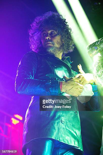 Wayne Coyne of The Flaming Lips holds a baby doll as he performs onstage at Egyptian Room at Old National Centre on April 29, 2013 in Indianapolis,...