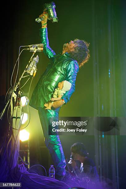 Wayne Coyne of The Flaming Lips holds a baby doll as he performs onstage at Egyptian Room at Old National Centre on April 29, 2013 in Indianapolis,...