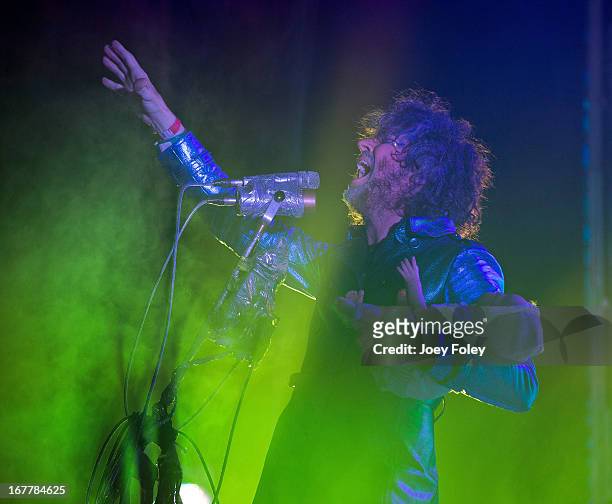 Wayne Coyne of The Flaming Lips holds a baby doll as he performs onstage at Egyptian Room at Old National Centre on April 29, 2013 in Indianapolis,...