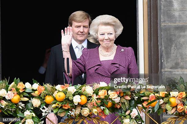 Queen Beatrix of the Netherlands and King Willem Alexander appear on the balcony of the Royal Palace to greet the public after her abdication and...