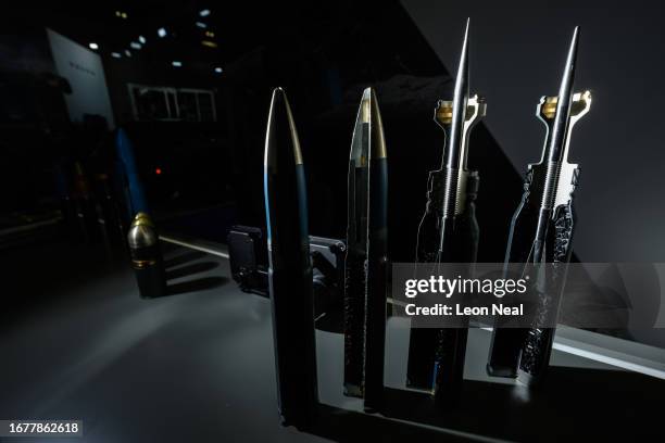 Cross-section of various rounds of ammunition by Nammo are seen on their display stand during day two of the Defence and Security Equipment...