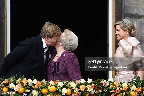 Queen Beatrix of the Netherlands with King Willem Alexander and Queen Maxima appear on the balcony of the Royal Palace to greet the public after her...