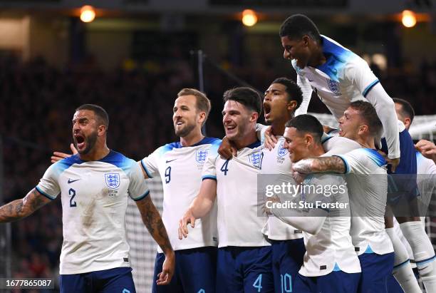 Jude Bellingham of England celebrates with team mates after scoring the team's aecond goal during the 150th Anniversary Heritage Match between...