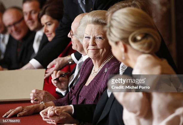 Queen Beatrix of the Netherlands smiles during the ceremony for the Act of Abdication in the Moseszaal at the Royal Palace on April 30, 2013 in...
