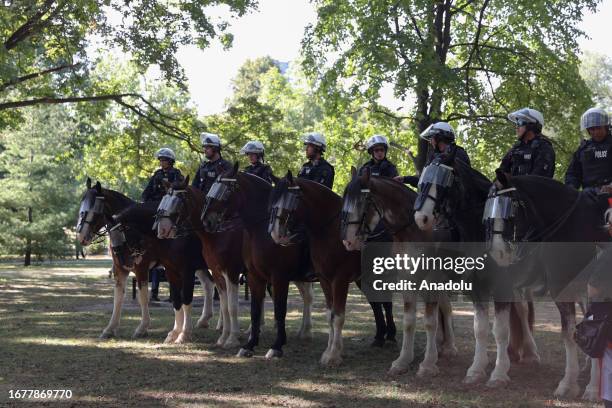 Mounted police stand guard as counter-protesters meet hundreds of people attending the '1 Million March for Children' rally organized by the parents...