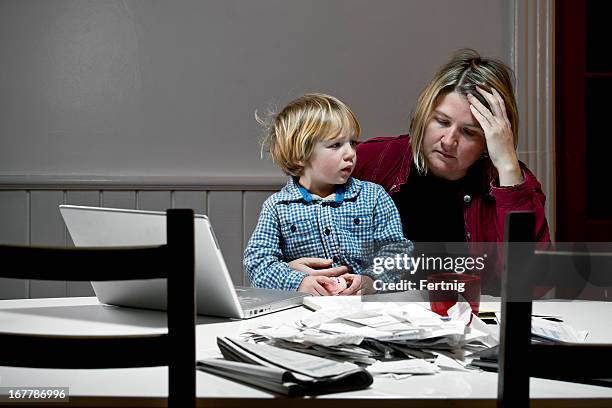 depressed woman overwhelmed with financial issues, debt, bankruptcy. - schulden stockfoto's en -beelden