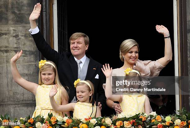 King Willem-Alexander of the Netherlands and HM Queen Maxima of the Netherlands appear on the balcony of the Royal Palace with their daughters...