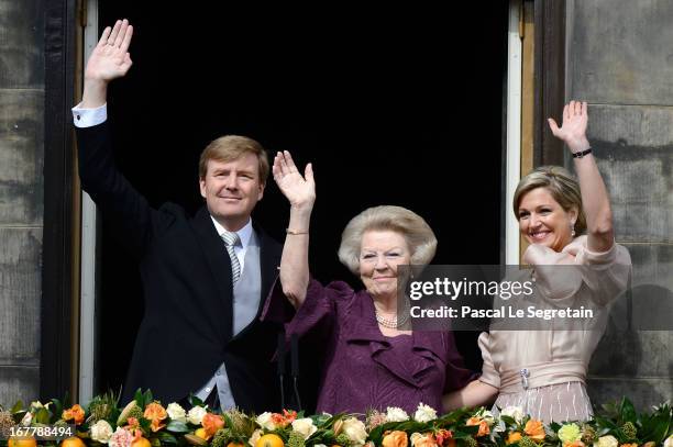 Princess Beatrix of the Netherlands with King Willem Alexander and Queen Maxima appear on the balcony of the Royal Palace to greet the public after...