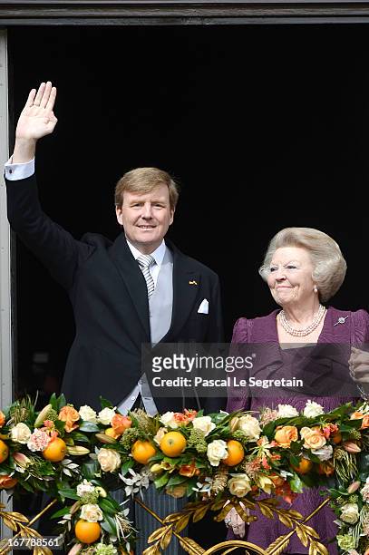 Princess Beatrix of the Netherlands and King Willem Alexander appear on the balcony of the Royal Palace to greet the public after her abdication and...