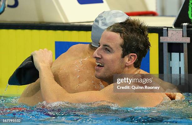 James Magnussen of Australia hugs Matt Targett after winning the Men's 100 Metre Freestyle Final during day five of the Australian Swimming...