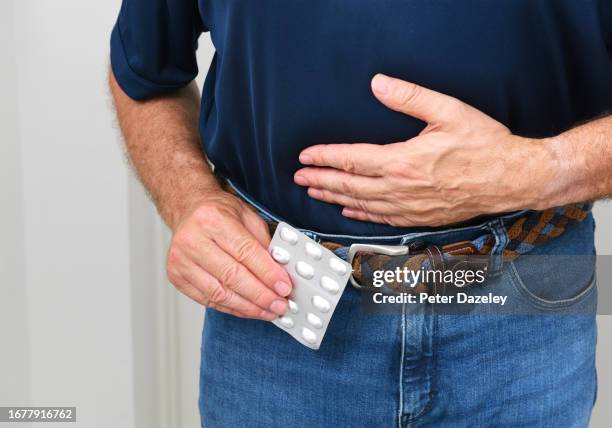 senior man in pain - ibuprofen stock pictures, royalty-free photos & images