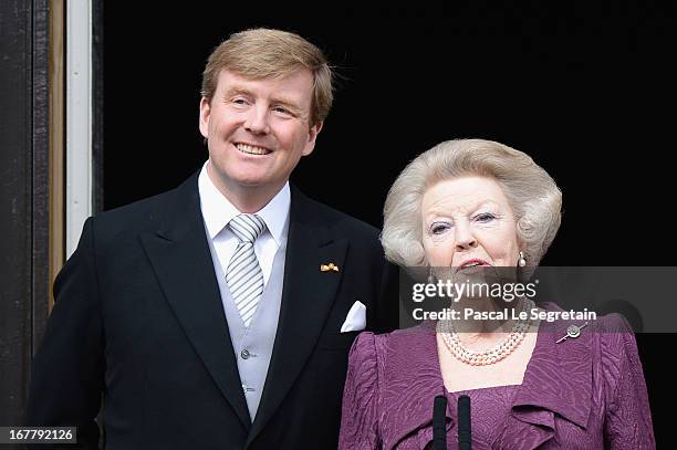 Princess Beatrix of the Netherlands and King Willem Alexander appear on the balcony of the Royal Palace to greet the public after her abdication and...