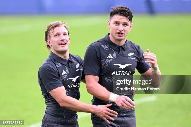 Damian McKenzie and Beauden Barrett of the All Blacks run through drills during a New Zealand All Blacks training session at LOU rugby club ahead of...