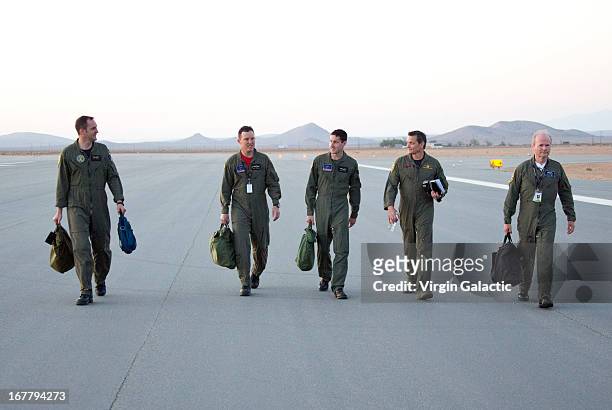 Pilots, Clint Nichols,Mike Alsbury,Brian Maisler, Mark Stuckey and Dave McKay of Virgin Galactic's WhiteKnight2 and SpaceShip2 walk towards the...