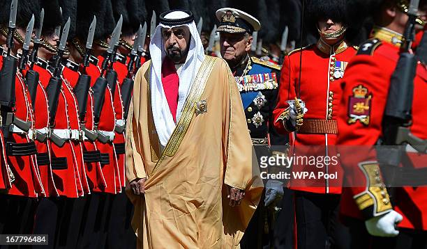Prince Philip, the Duke of Edinburgh and President of the United Arab Emirates, His Highness Sheikh Khalifa bin Zayed Al Nahyan inspect an honour...
