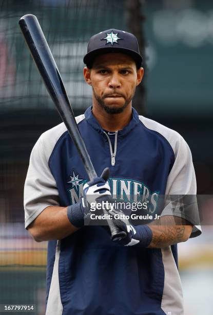 Robert Andino of the Seattle Mariners looks on during batting practice prior to the game against the Los Angeles Angels of Anaheim at Safeco Field on...