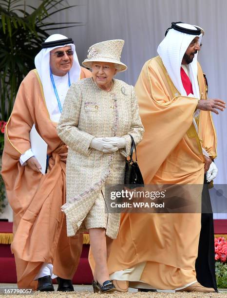 Queen Elizabeth II and President of the United Arab Emirates, His Highness Sheikh Khalifa bin Zayed Al Nahyan leave following a ceremonial welcome in...