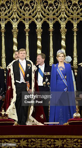 King Willem-Alexander of the Netherlands stands alongside Queen Maxima of the Netherlands during his swearing in and investiture ceremony in front of...