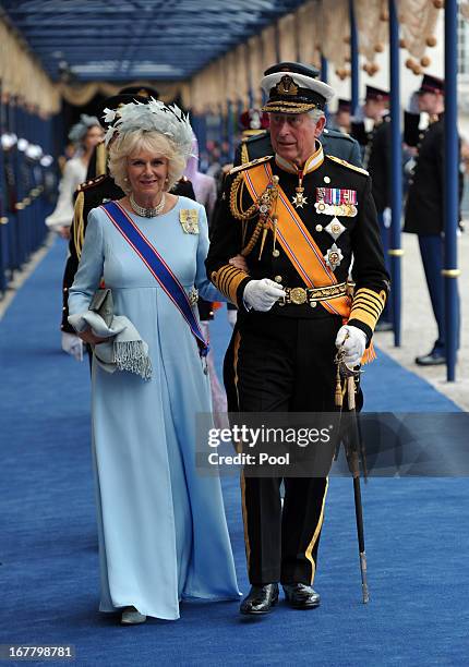 Prince Charles, Prince of Wales and Camilla, Duchess of Cornwall leave following the inauguration ceremony for HM King Willem Alexander of the...