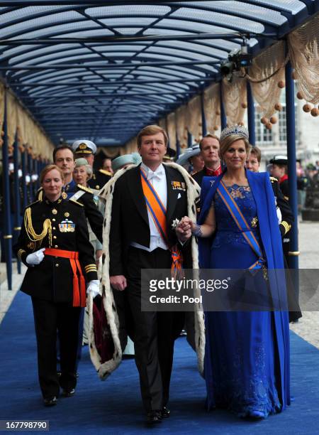 King Willem Alexander of the Netherlands and HM Queen Maxima of the Netherlands leave following the inauguration ceremony at New Church on April 30,...