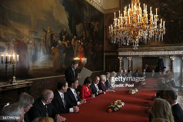 Chairmen of the Senate and the House and other ministers sign the Act of Abdication after Queen Beatrix of the Netherlands , Prince Willem-Alexander...