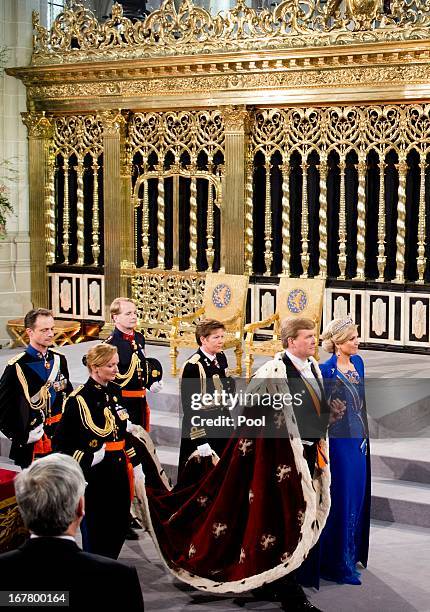 King Willem Alexander of the Netherlands leaves with HM Queen Maxima of the Netherlands after their inauguration ceremony at New Church on April 30,...