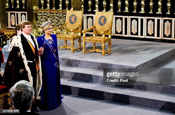 King Willem Alexander of the Netherlands leaves with HM Queen Maxima of the Netherlands after their inauguration ceremony at New Church on April 30,...