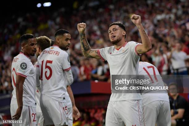 Sevilla's Argentinian forward Lucas Ocampos celebrates scoring his team's first goal during the UEFA Champions League 1st round day 1 group B...