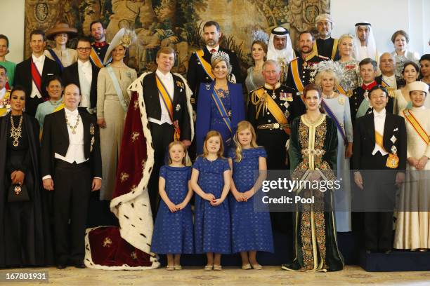 King Willem Alexander and Queen Maxima of the Netherlands pose with guests following their inauguration ceremony, at the Royal Palace on April 30,...