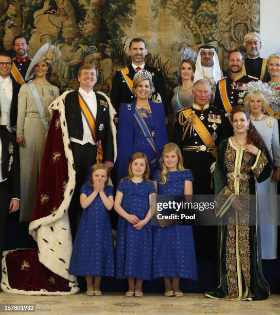 King Willem Alexander and Queen Maxima of the Netherlands pose with guests following their inauguration ceremony, at the Royal Palace on April 30,...