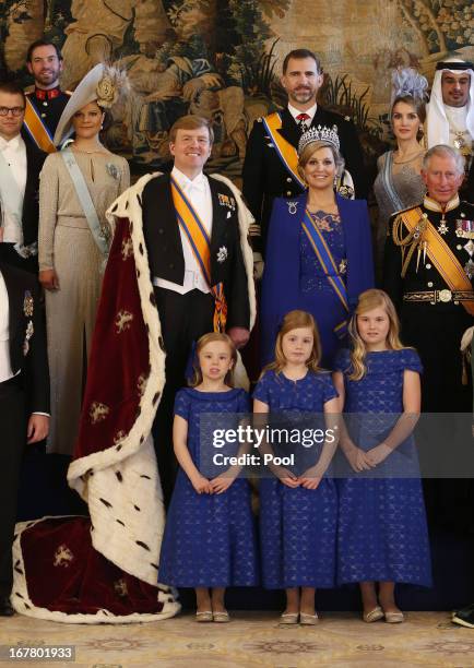 King Willem Alexander and Queen Maxima of the Netherlands pose with guests following their inauguration ceremony, at the Royal Palace on April 30,...