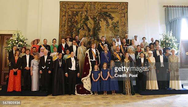 King Willem Alexander and Queen Maxima of the Netherlands pose with guests following their inauguration ceremony, at the Royal Palace on April 30,...