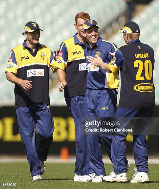 Robert Cassell of the Bushrangers celebrates taking a wicket with teammates during the ING Cup match between Victorian Bushrangers and the Southern...