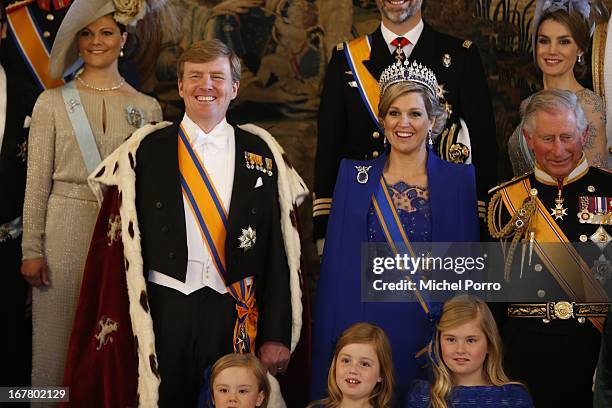 King Willem Alexander and Queen Maxima of the Netherlands pose with guests following their inauguration ceremony, at the Royal Palace on April 30,...