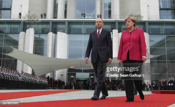 German Chancellor Angela Merkel welcomes new Italian Prime Minister Enrico Letta at the Chancellery on April 30, 2013 in Berlin, Germany. Letta is in...