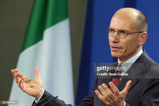 New Italian Prime Minister Enrico Letta speaks to the media with German Chancellor Angela Merkel following talks at the Chancellery on April 30, 2013...