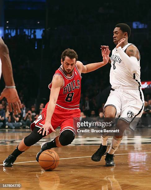 Marco Belinelli of the Chicago Bulls dribbles the ball against the Brooklyn Nets during Game Five of the Eastern Conference Quarterfinals of the 2013...