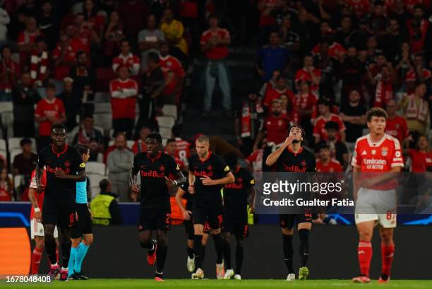Roko Simic of FC Salzburg celebrates with teammates after scoring a goal during the Group D - UEFA Champions League 2023/24 match between SL Benfica...