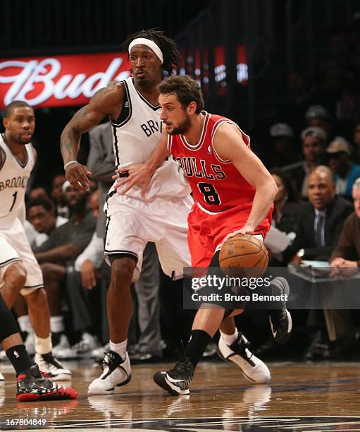 Marco Belinelli of the Chicago Bulls dribbles the ball against the Brooklyn Nets during Game Five of the Eastern Conference Quarterfinals of the 2013...