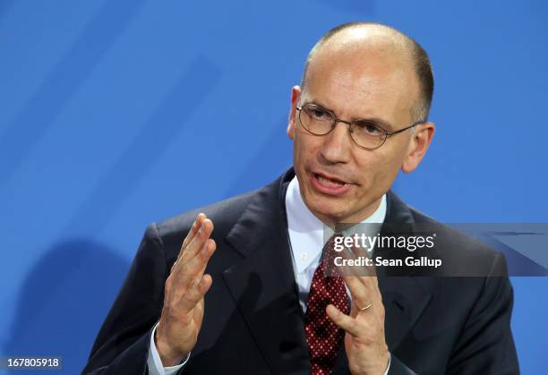 New Italian Prime Minister Enrico Letta speaks to the media with German Chancellor Angela Merkel following talks at the Chancellery on April 30, 2013...