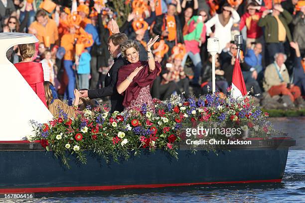 King Willem Alexander and Queen Maxima are seen aboard the Kings boat for the water pageant to celebrate the inauguration of King Willem of the...