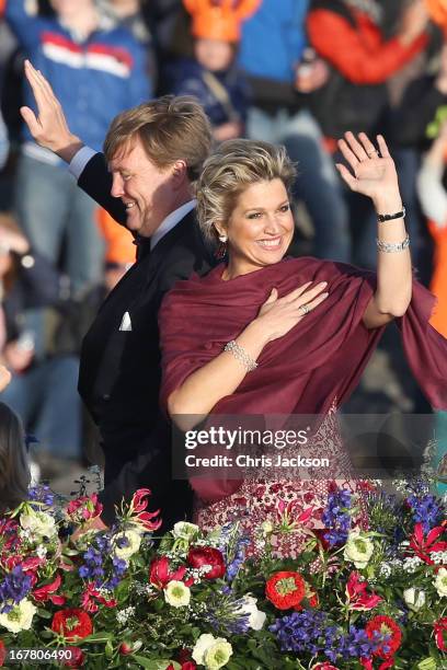 King Willem Alexander and Queen Maxima are seen aboard the Kings boat for the water pageant to celebrate the inauguration of King Willem of the...