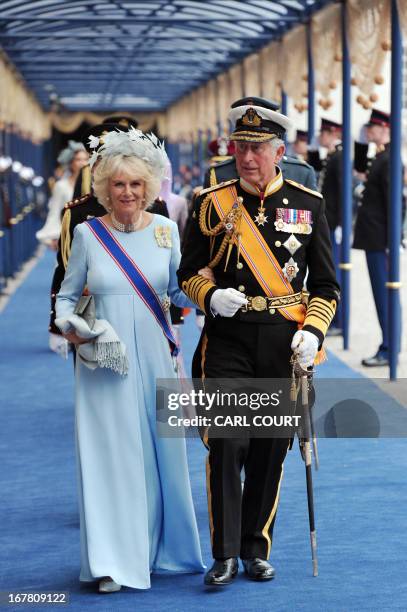 Britain's Prince Charles of Wales and his wife Camilla, Duchess of Cornwall leave the Nieuwe Kerk in Amsterdam on April 30, 2013 following the...