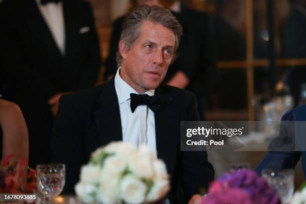British actor Hugh Grant looks on during a state banquet at the Palace of Versailles, on September 20, 2023 in Versailles, France. The King and...