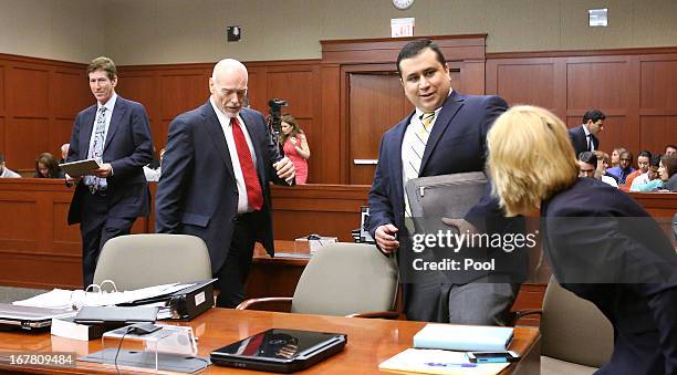 George Zimmerman , defendant in the killing of Trayvon Martin, srives in Seminole circuit court with his attorneys Mark O'Mara and Don West during a...